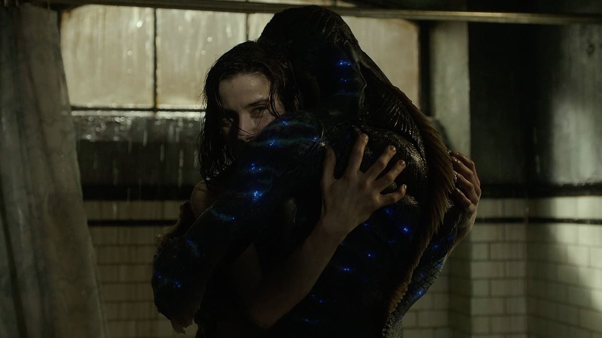 Elisa and the water creature hugging.